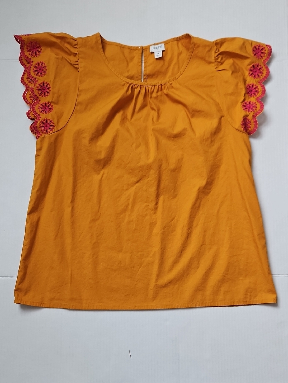 J. Crew Mustard Yellow Blouse with Pink Eyelet Sleeve Detail